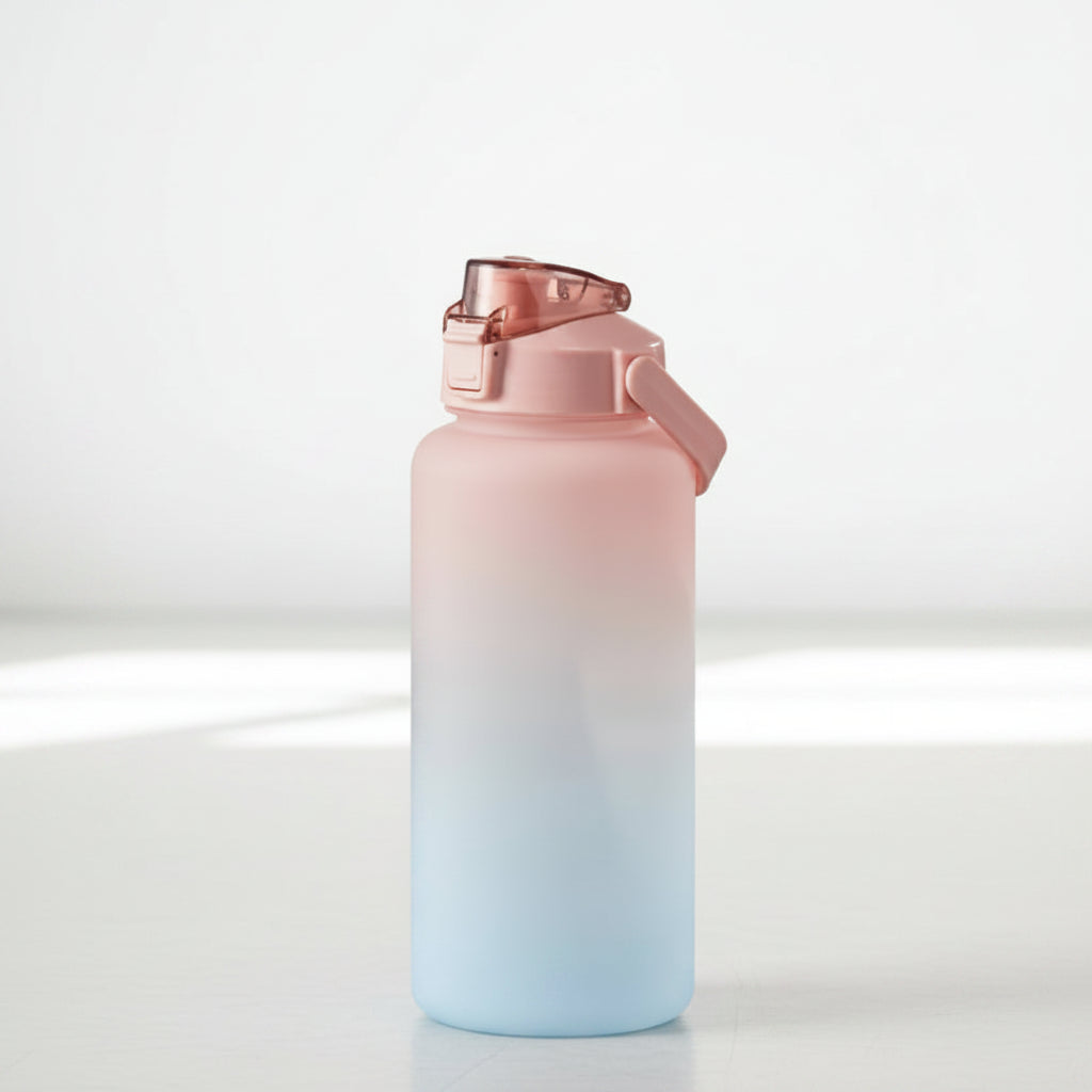 Gradient water bottle with pink to blue color change on a white background