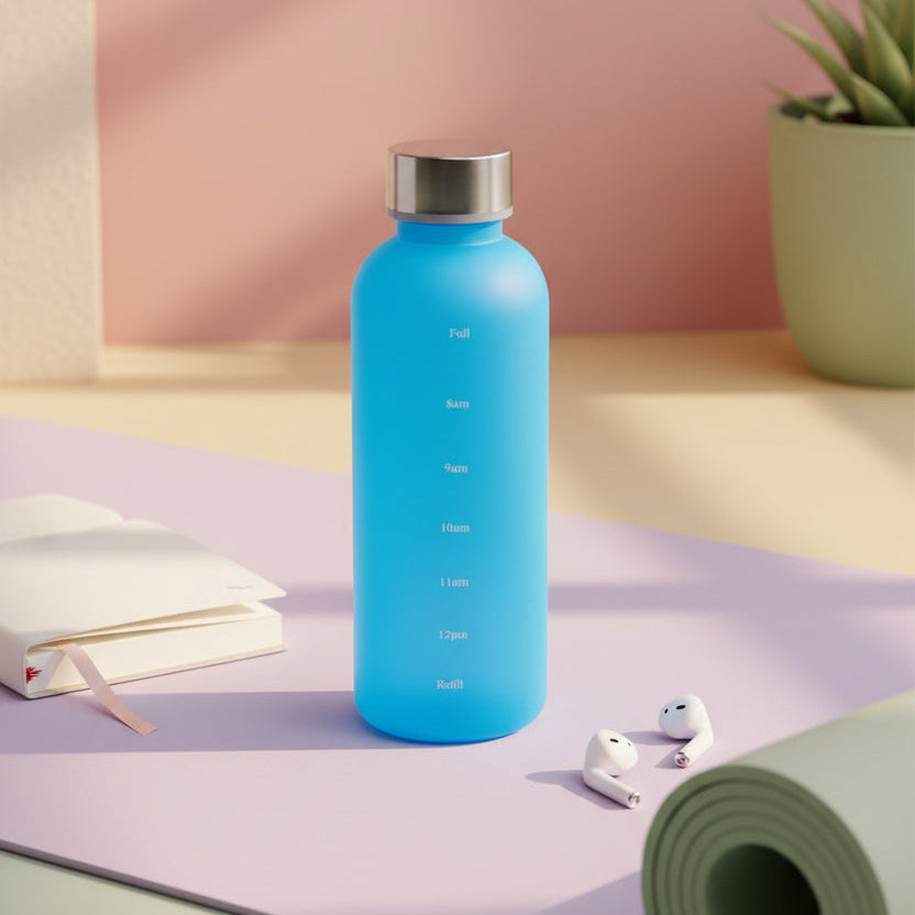Blue water bottle with a silver cap on a light surface with a neutral background