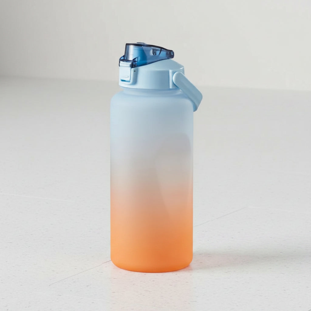 Gradient water bottle with blue top and orange bottom on a white background
