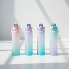 Gradient-colored water bottles held by hands against a blue background